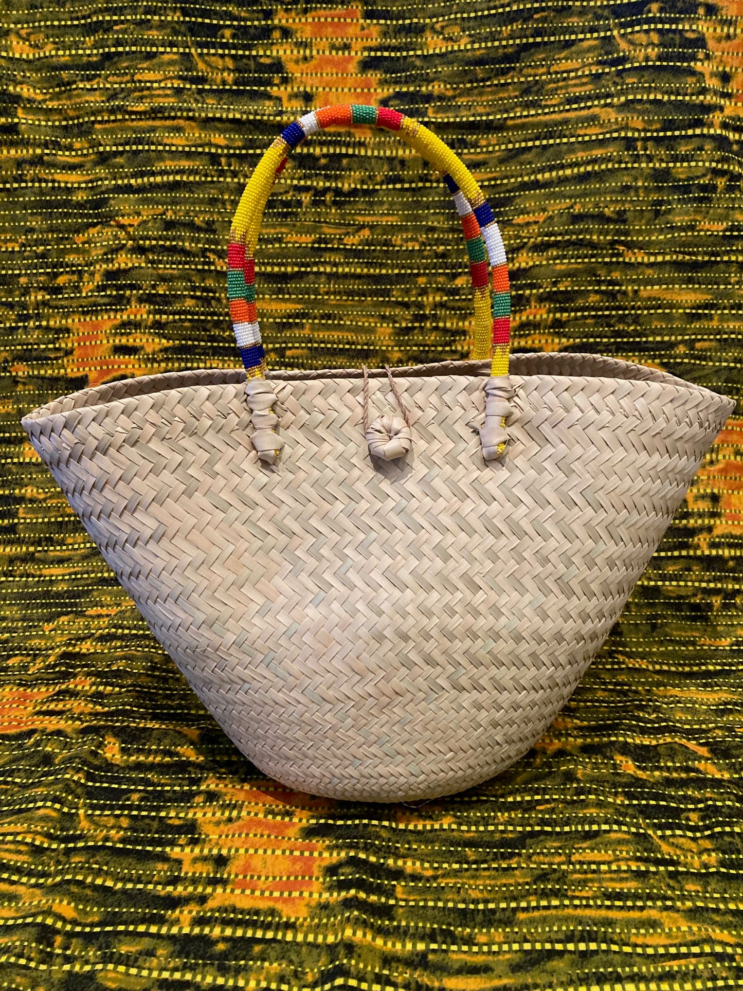 Natural basket with beaded handles