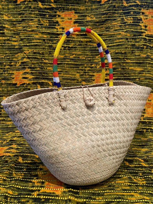 Natural basket with beaded handles